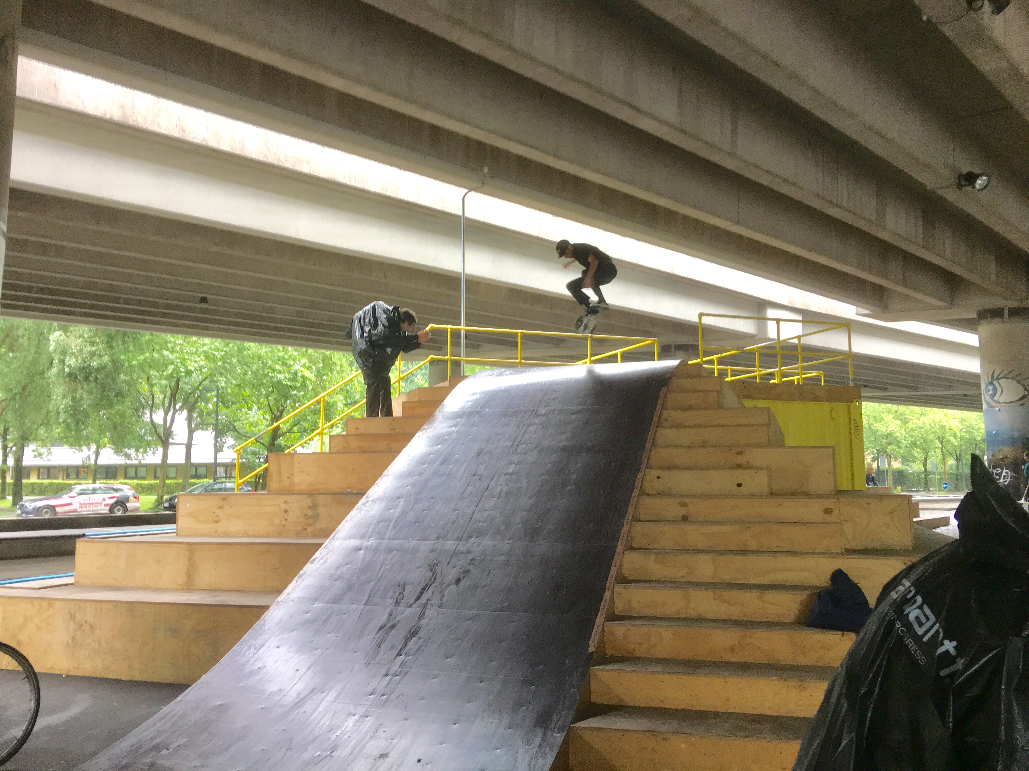 Jimmy kickflips into the bank...during lots of rain